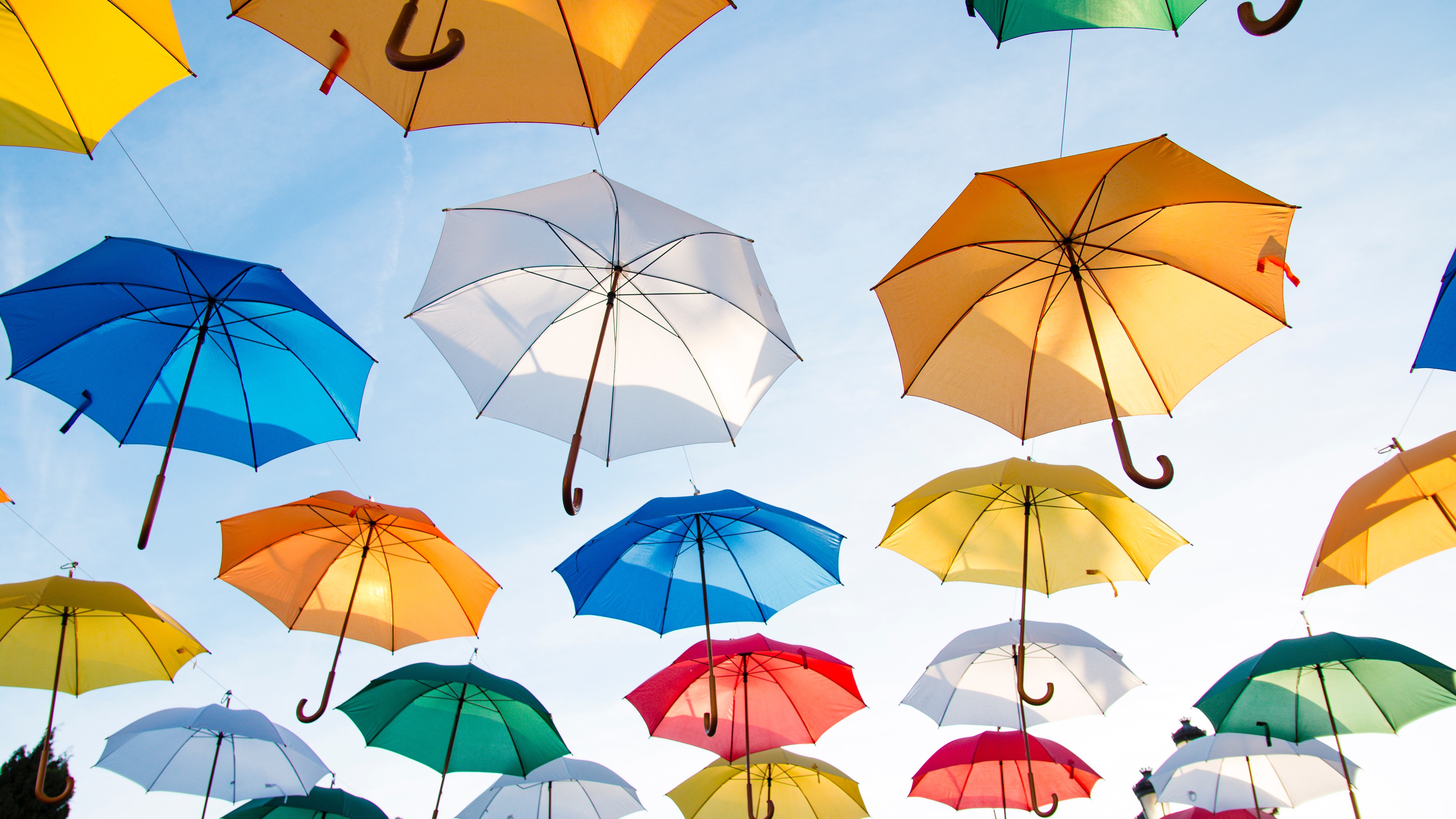 Multi-colored umbrellas float down from the sky. Understand valuation and all your options for protecting your move.